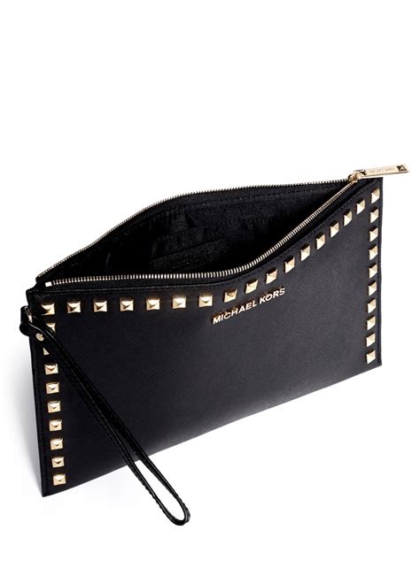 michael kors hand clutch women|Michael Kors studded clutch.